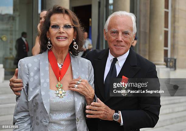 Italian actress Claudia Cardinale and Italian fashion designer Giorgio Armani pose with their Legion of Honour medals in the courtyard of the Elysee...
