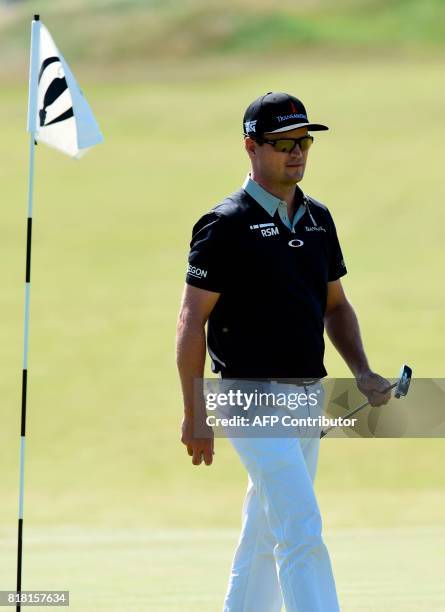 Golfer Zach Johnson walks on the 8th green during a practice round at Royal Birkdale golf course near Southport in north west England on July 18...