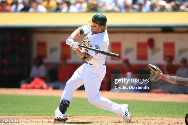 Travis Buck of the Oakland Athletics bats during the game against the Los Angeles Angels at the McAfee Coliseum in Oakland, California on June 8,...