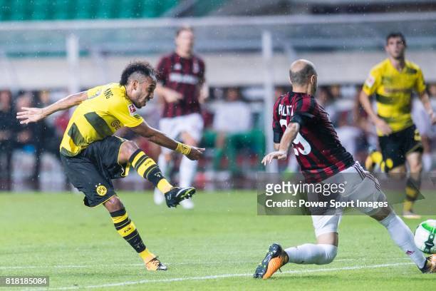 Borussia Dortmund Forward Pierre-Emerick Aubameyang attempts a kick while being defended by AC Milan Defender Gabriel Paletta during the...