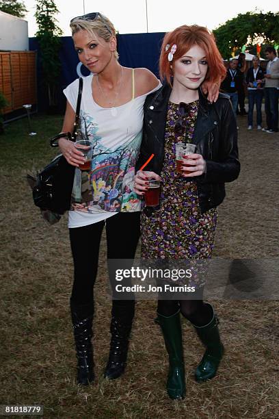 Girls Aloud Singers Nicola Roberts and Sarah Harding pose behind the main stage in the O2 VIP Lounge during Day One of the O2 Wireless Festival in...