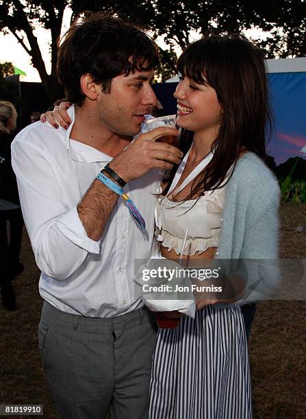 Musician Mark Ronson and Model Daisy Lowe stay close together behind the main stage in the O2 VIP Lounge during Day One of the O2 Wireless Festival...
