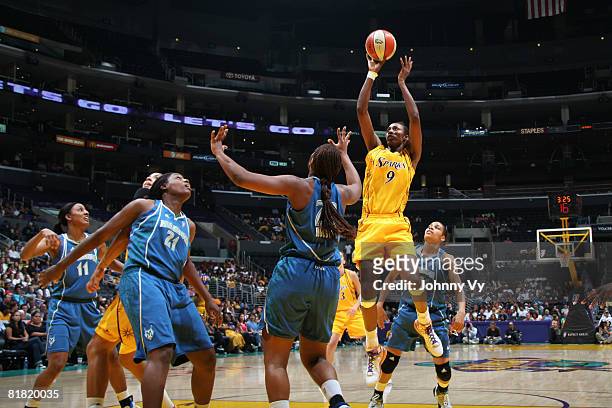 Lisa Leslie of the Los Angeles Sparks shoots against Charde Houston of the Minnesota Lynx during their game on July 3, 2008 at Staples Center in Los...