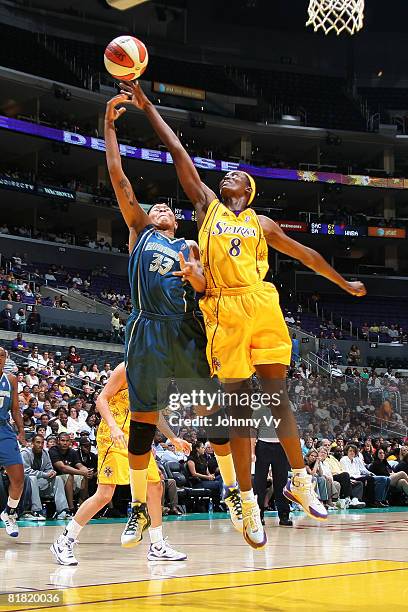 Seimone Augustus of the Minnesota Lynx has her shot contested by DeLisha Milton-Jones of the Los Angeles Sparks during their game on July 3, 2008 at...