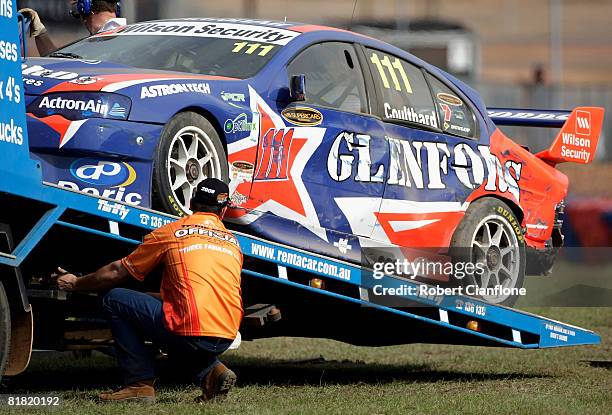 Fabien Coulthard of Glenfords Racing has his car placed onto a tow truck after he crashed during practice for round six of the V8 Supercars...