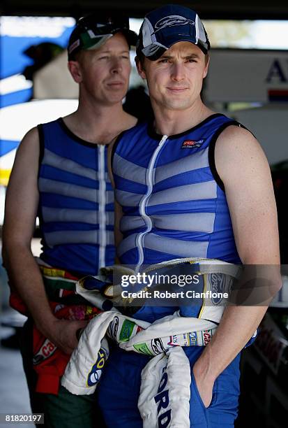 Mark Winterbottom and Steven Richards of Ford Performance Racing keep cool with ice vests during practice for round six of the V8 Supercars...