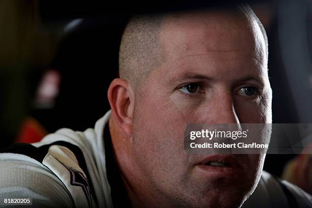 Paul Morris of Supercheap Auto Racing looks on during practice for round six of the V8 Supercars Championship Series at Hidden Valley Raceway on July...
