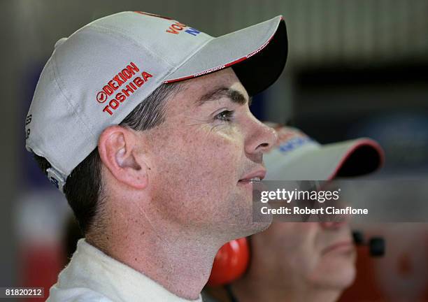 Craig Lowndes of Team Vodafone and Team Principal Roland Dane watch the timing screens during practice for round six of the V8 Supercars Championship...