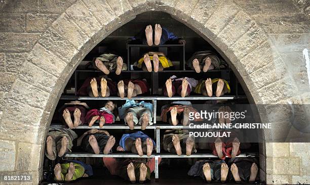 Comedians perform during a rehearsal of "Inferno", a play inspired by the Dante "Divine Comedy", directed by Italian Romeo Castellucci, on July 03,...