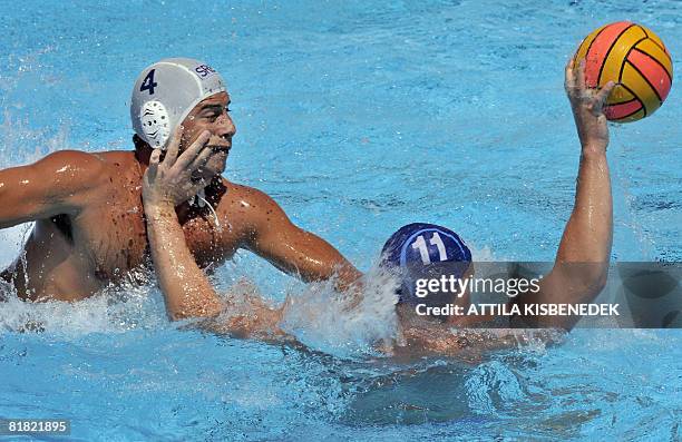 German Andreas Schlotterbeck vies with Serbian Vanja Udovicic in the aquatic center swimming pool of Spanish seaside town Malaga on July 4, 2008...