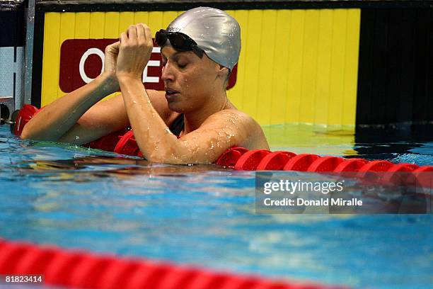 Amanda Beard hangs on the lane line after the preliminary heats of the 200 meter breaststroke during the U.S. Swimming Olympic Trials on July 3, 2008...