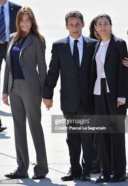 Freed hostage Ingrid Betancourt is greeted by president Nicolas Sarkozy and his wife Carla Bruni-Sarkozy on arriving at the military base of...