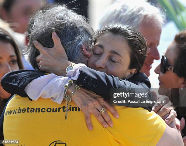 Ingrid Betancourt hugs an unidentified member of her support committee during the arrival ceremony at military base of Villacoublay on July 4, 2008...