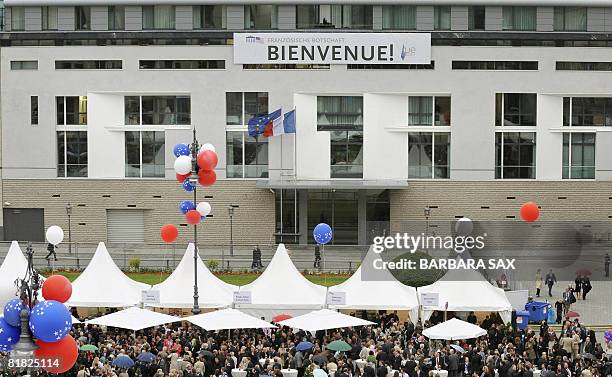 Banner reading "Welcome!" is fixed on the French embassy to Germany, seen during the opening ceremony for the new US embassy building on the "Pariser...