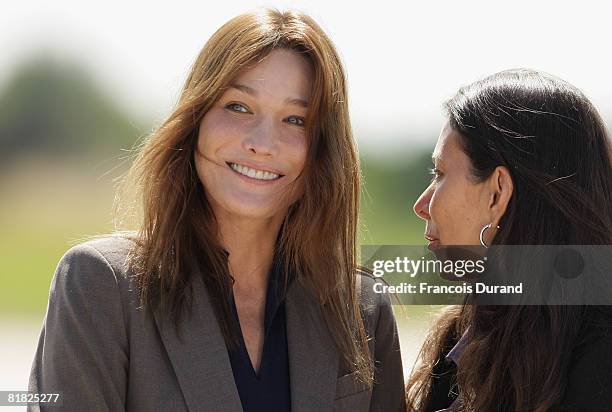 Carla Bruni-Sarkozy and Astrid Betancourt await the arrival of Ingrid Betancourt at the military base of Villacoublay on July 4, 2008 in Velizy...