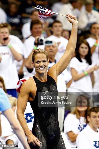 Dara Torres waves to the crowd after winning the final of the 100 meter freestyle and qualifying for her fifth Olympic team during the U.S. Swimming...