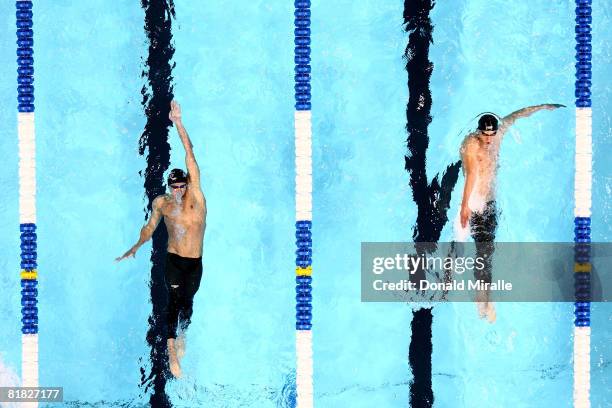 Ryan Lochte and Michael Phelps battle each other in the final of the 200 meter individual medley during the U.S. Swimming Olympic Trials on July 4,...