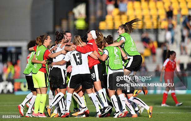 Austria's players celebrate their victory against Switzerland, at the end of the UEFA Women's Euro 2017 football tournament match at De Adelaarshorst...