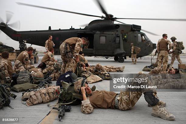 British Paratroopers from the 3rd Battalion The Parachute Regiment wait at their base at the Kandahar Air Field to board Chinook Helicopters to be...