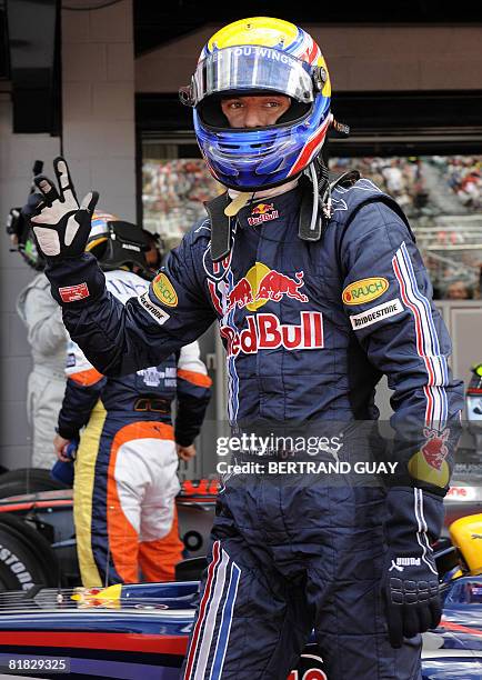 Red Bull's Australian driver Mark Webber celebrates in the parc ferme of the Silverstone racetrack on July 5, 2008 in Silverstone, England, after the...