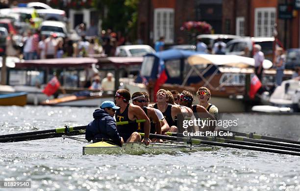 Members of the Trinity College, Hartford of the United States of America row team rest after winning their heat in the Temple Challenge Cup during...