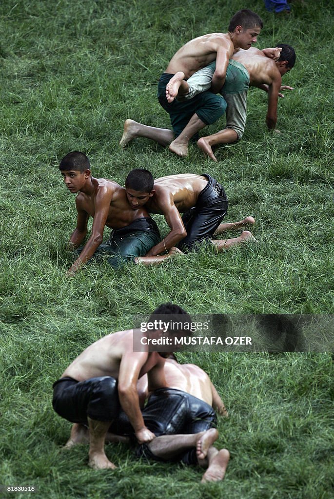 Turkish oil wrestlers fight during the K