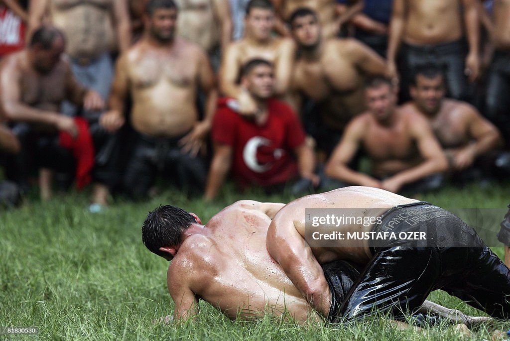 Turkish oil wrestlers fight during the K