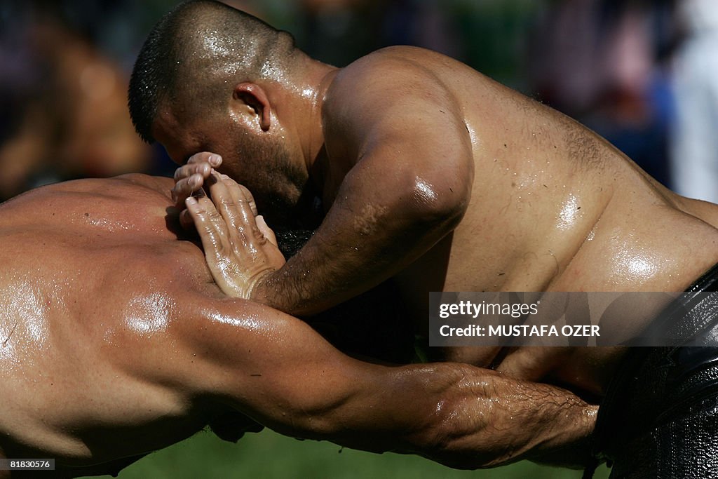 Turkish oil wrestlers fight during the K