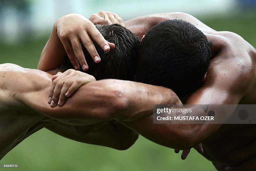 Turkish oil wrestlers fight during the K