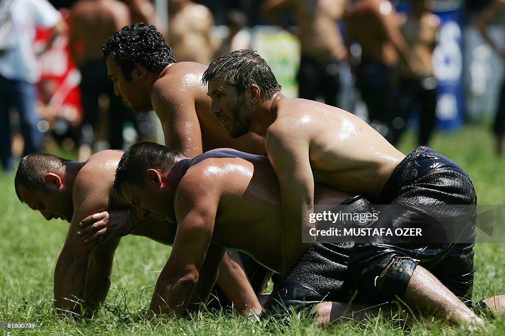 Turkish oil wrestlers fight during the K