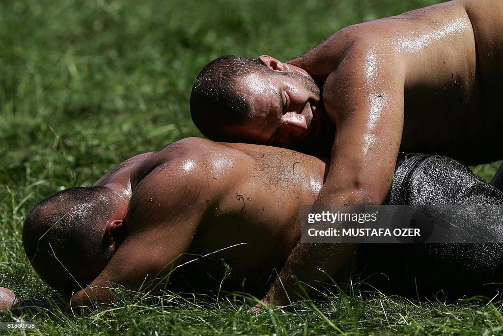 Turkish oil wrestlers fight during the K