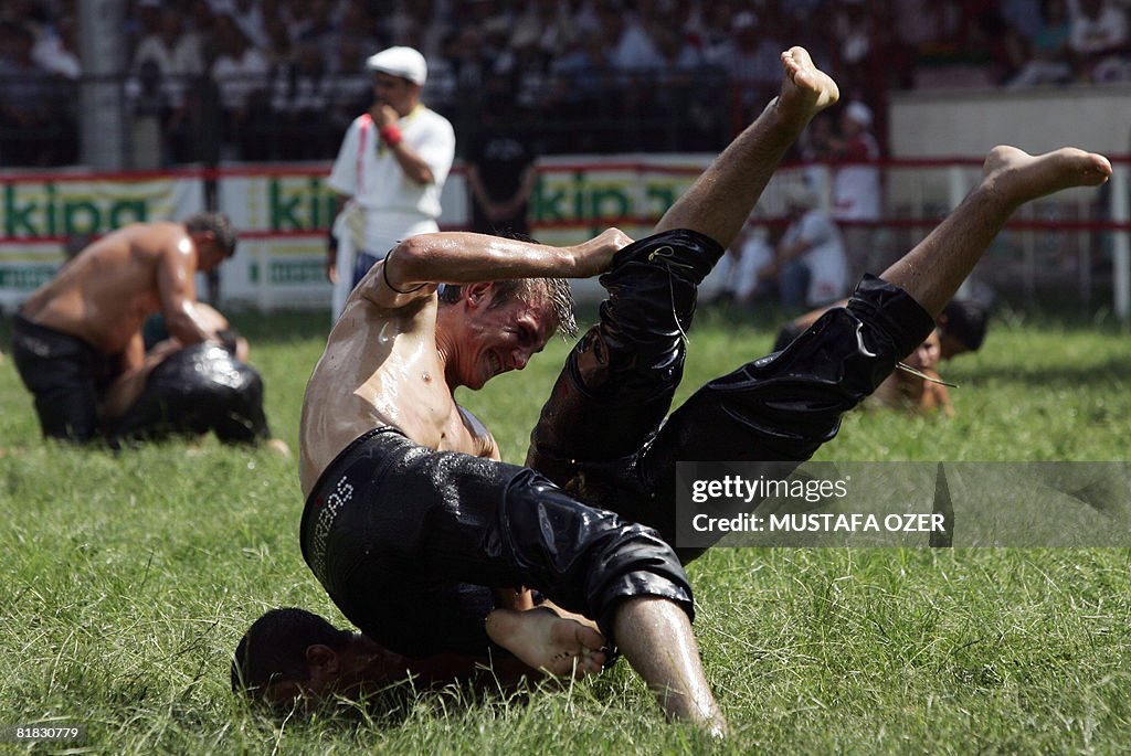 Turkish oil wrestlers fight during the K
