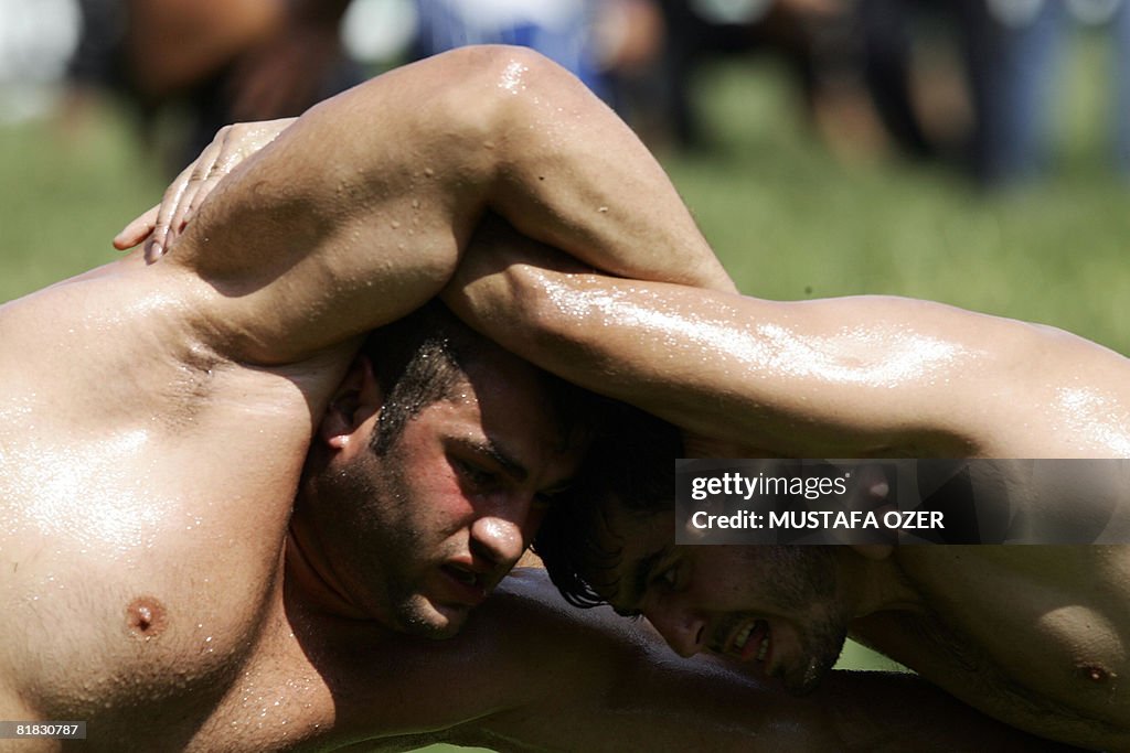 Turkish oil wrestlers fight during the K