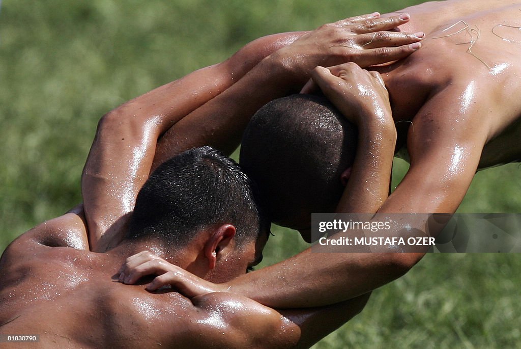 Turkish oil wrestlers fight during the K