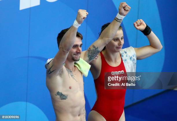 Laura Marino and Mattieu Rosset of France celebrate winning the gold medal during the Mixed Diving Team final on day five of the Budapest 2017 FINA...