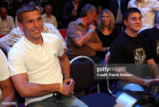 Soccer star Lukas Podolski looks on during the fight between Felix Sturm of Germany and Randy Griffin of United States of America at the Gerry Weber...