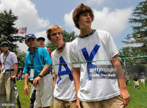 Anthony Kim fans, Matthew Carr, and Conrad Depeuter, watch play at the third tee box during the third round of the AT&T National held on the Blue...