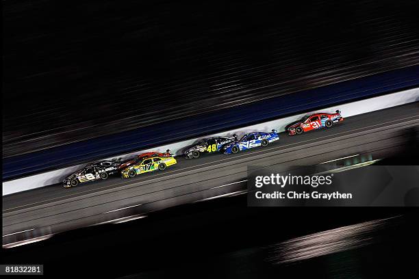 Mark Martin, driver of the U.S. Army Chevrolet leads a pack of cars during the NASCAR Sprint Cup Series Coke Zero 400 at Daytona International...