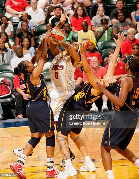 Tammy Sutton-Brown of the Indiana Fever batles Tamika Whitmore and Amber Holt of the Connecticut Sun at Conseco Fieldhouse on July 5, 2008 in...