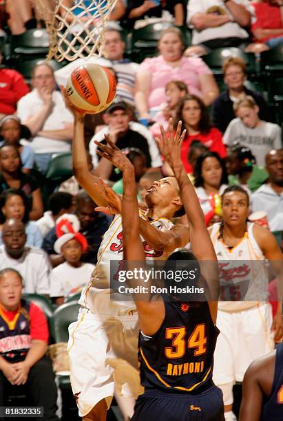 LaToya Bond of the Indiana Fever shoots over Tamika Raymond of the Connecticut Sun at Conseco Fieldhouse on July 5, 2008 in Indianapolis, Indiana....