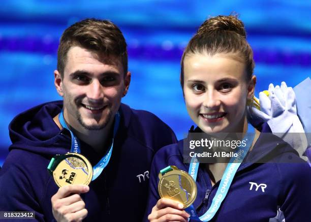 Gold medalists Laura Marino and Mattieu Rosset of France pose with the medals won during the Mixed Diving Team final on day five of the Budapest 2017...