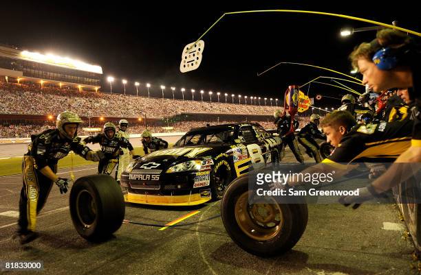 Mark Martin, driver of the U.S. Army Chevorlet, makes a pit stop during the NASCAR Sprint Cup Series Coke Zero 400 at Daytona International Speedway...
