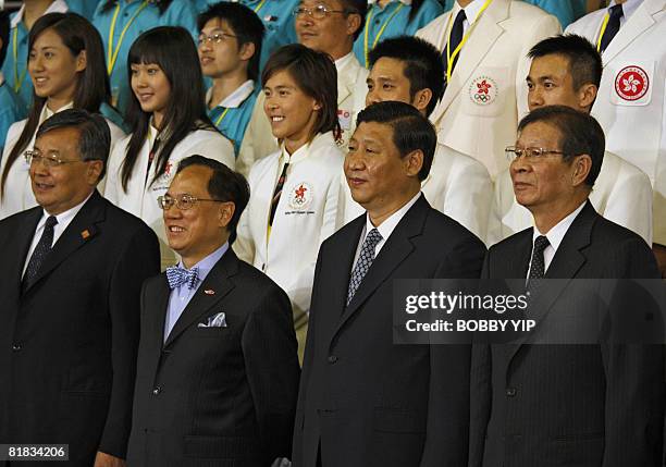 Chinese Vice President Xi Jinping and Hong Kong Chief Executive Donald Tsang pose for a photo with Hong Kong athletes at the Olympic Games equestrian...