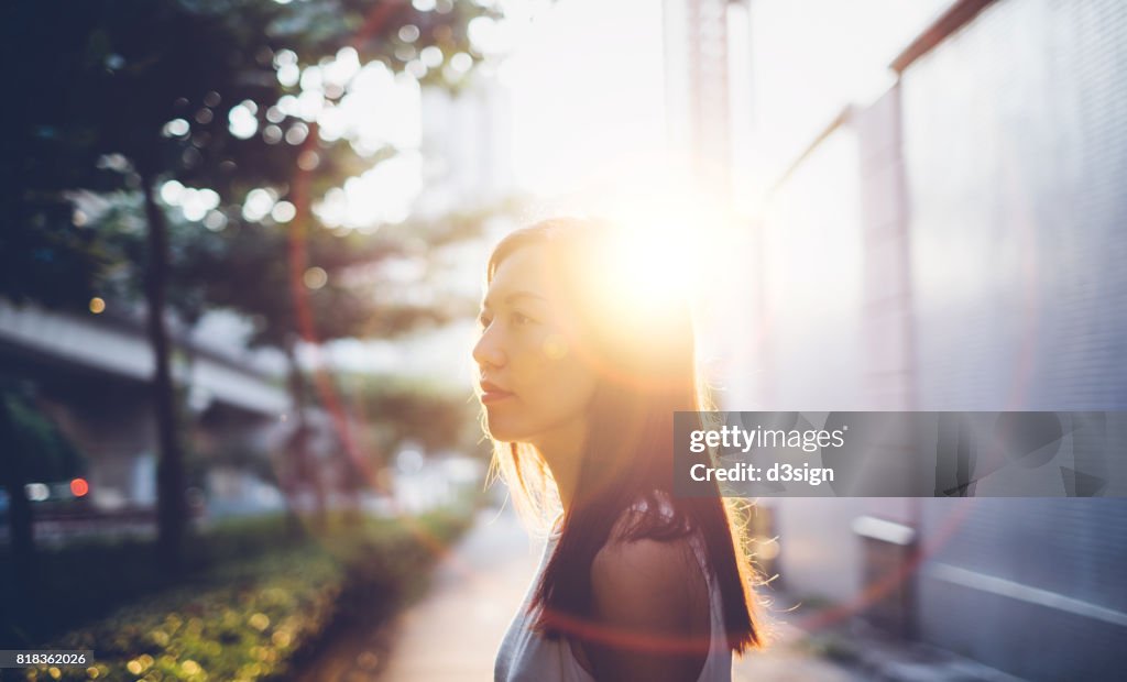Beautiful young girl having a refreshing morning in sunrise