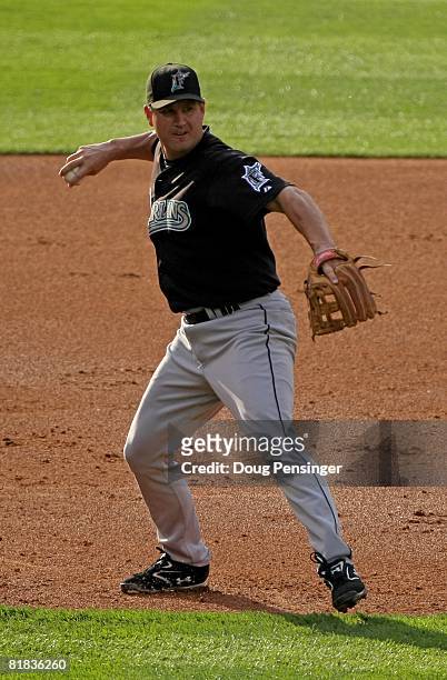 Third baseman Wes Helms of the Florida Marlins throws out a runner against the Colorado Rockies at Coors Field on July 3, 2008 in Denver, Colorado....