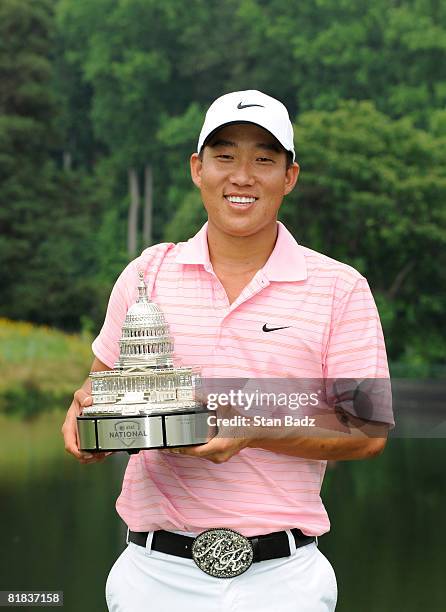 Anthony Kim holds the winner's trophy after the final round of the AT&T National held on the Blue Golf Course at Congressional Country Club on July...