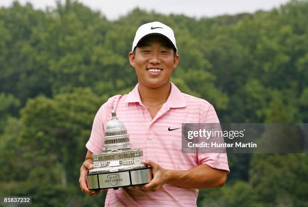 Anthony Kim holds the championship trophy after winning the AT&T National at Congressional Country Club on July 6, 2008 in Bethesda, Maryland.