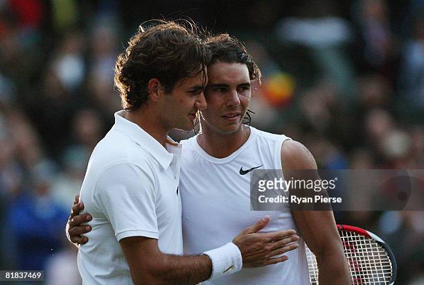 Roger Federer of Switzerland congratulates Rafael Nadal of Spain in winning match point and the Championship during the men's singles Final on day...