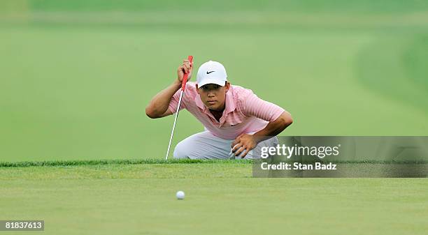 Anthony Kim lines up his putt at the 17th green during the final round of the AT&T National held on the Blue Golf Course at Congressional Country...