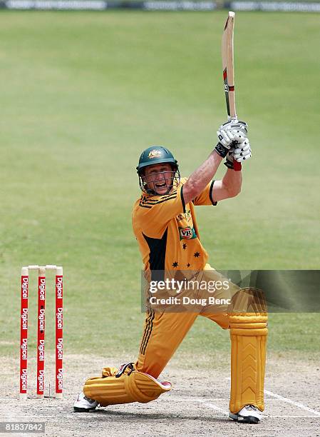 David Hussey of Australia follows through on a four during the One-Day International game five match between Australia and the West Indies at Warner...